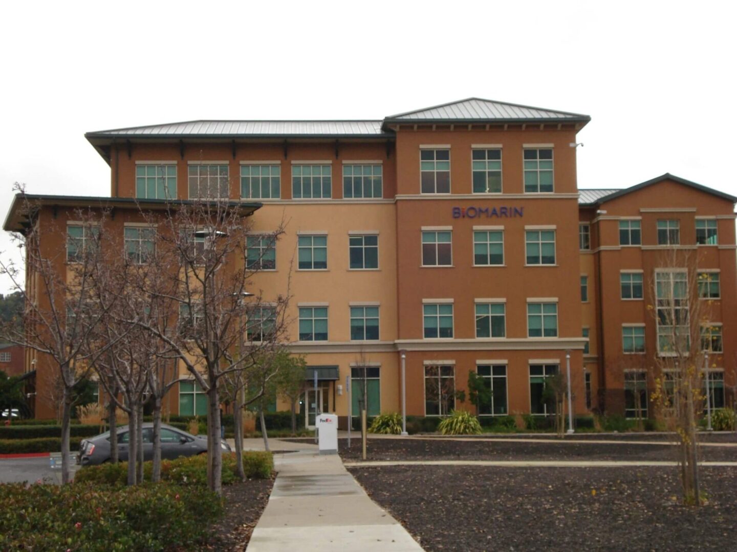 A building with many windows and a walkway.